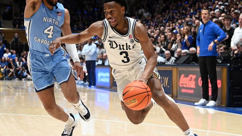 Feb 4, 2023; Durham, North Carolina, USA; Duke Blue Devils guard Jeremy Roach (3) drives to the basket against North Carolina Tar Heels guard RJ Davis (4) during the second half at Cameron Indoor Stadium. The Blue Devils won 63-57. Mandatory Credit: Rob Kinnan-USA TODAY Sports