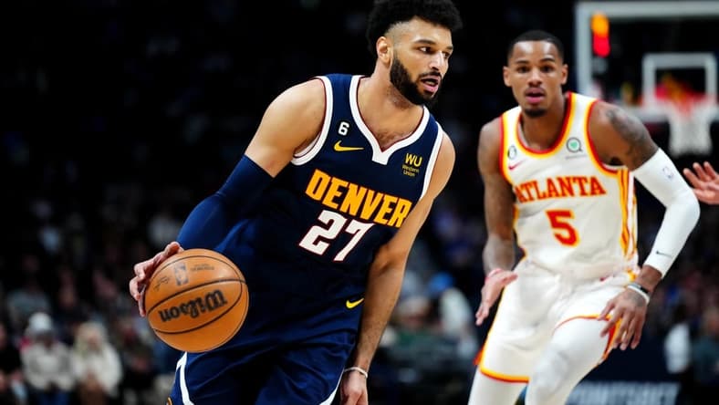 Feb 4, 2023; Denver, Colorado, USA; Denver Nuggets guard Jamal Murray (27) controls the ball in the second quarter against the Atlanta Hawks at Ball Arena. Mandatory Credit: Ron Chenoy-USA TODAY Sports