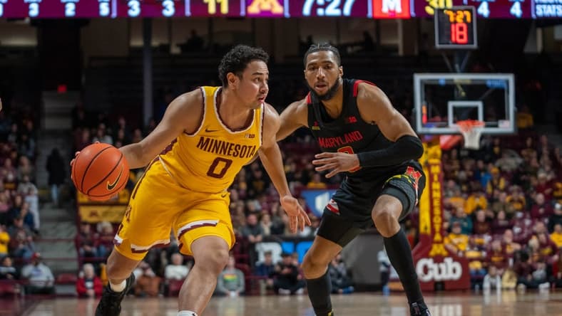 Feb 4, 2023; Minneapolis, Minnesota, USA; Minnesota Golden Gophers guard Taurus Samuels (0) dribbles on Maryland Terrapins guard Don Carey (0) in the first half at Williams Arena. Mandatory Credit: Matt Blewett-USA TODAY Sports