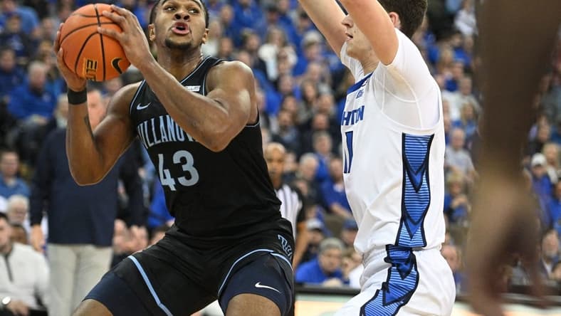 Feb 4, 2023; Omaha, Nebraska, USA; Villanova Wildcats forward Eric Dixon (43) drives against Creighton Bluejays center Ryan Kalkbrenner (11) in the first half at CHI Health Center Omaha. Mandatory Credit: Steven Branscombe-USA TODAY Sports