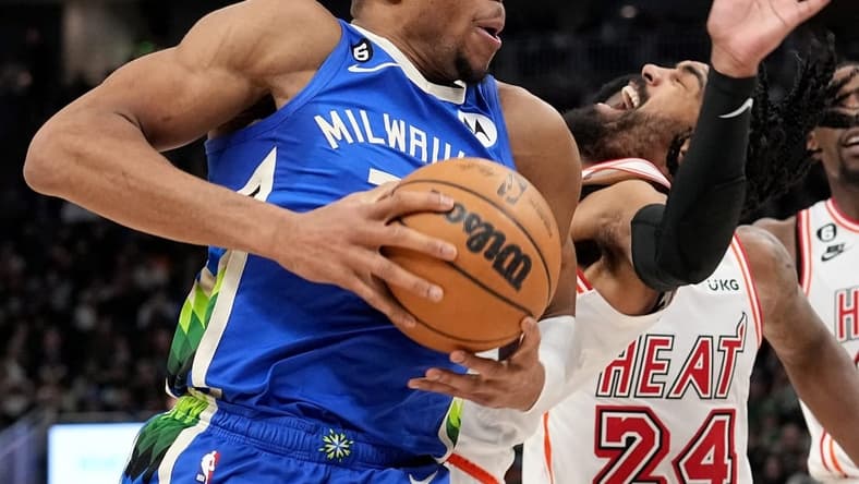 Bucks forward Giannis Antetokounmpo collides with Heat guard Gabe Vincent on a drive to the rim during the second half Saturday night at Fiserv Forum.
Mjs Bucks04 11 Jpg Bucks04
