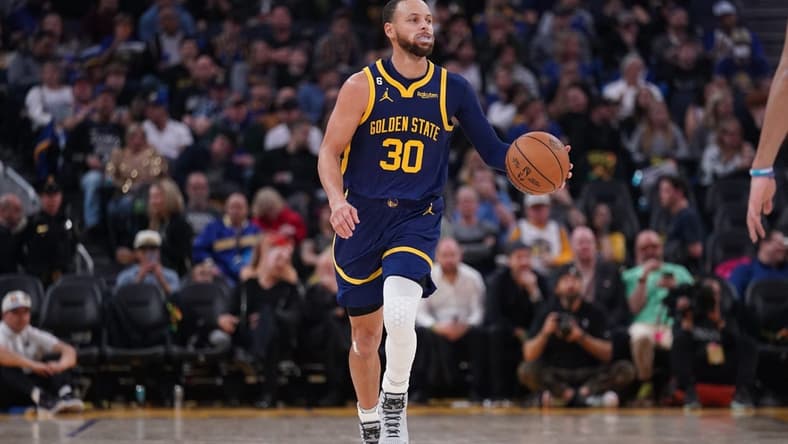 Feb 4, 2023; San Francisco, California, USA; Golden State Warriors guard Stephen Curry (30) dribbles the ball against the Dallas Mavericks in the third quarter at the Chase Center. Mandatory Credit: Cary Edmondson-USA TODAY Sports