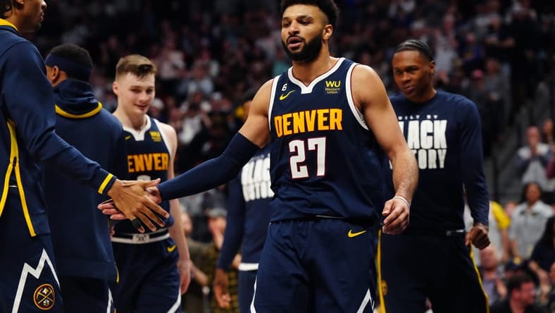 Feb 4, 2023; Denver, Colorado, USA; Denver Nuggets guard Jamal Murray (27) celebrates a play in the fourth quarter against the Atlanta Hawks at Ball Arena. Mandatory Credit: Ron Chenoy-USA TODAY Sports