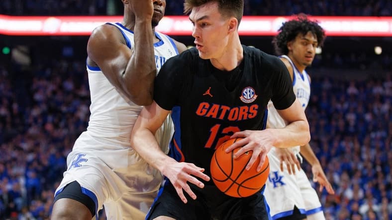 Feb 4, 2023; Lexington, Kentucky, USA; Florida Gators forward Colin Castleton (12) handles the ball against the Kentucky Wildcats during the first half at Rupp Arena at Central Bank Center. Mandatory Credit: Jordan Prather-USA TODAY Sports