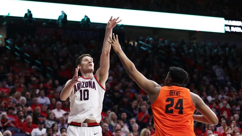 Feb 4, 2023; Tucson, Arizona, USA; Arizona Wildcats forward Azuolas Tubelis (10) makes a basket against Oregon State Beavers center KC Ibekwe (24) in the second half at McKale Center. Mandatory Credit: Zachary BonDurant-USA TODAY Sports