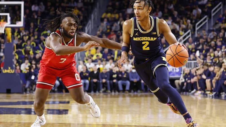 Feb 5, 2023; Ann Arbor, Michigan, USA; Michigan Wolverines guard Kobe Bufkin (2) dribbles on Ohio State Buckeyes guard Bruce Thornton (2) in the first half at Crisler Center. Mandatory Credit: Rick Osentoski-USA TODAY Sports
