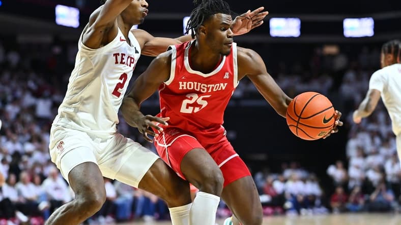 Feb 5, 2023; Philadelphia, Pennsylvania, USA; Houston Cougars forward Jarace Walker (25) controls the ball against Temple Owls guard Jahlil White (2) in the first half at The Liacouras Center. Mandatory Credit: Kyle Ross-USA TODAY Sports