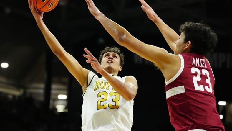 Feb 5, 2023; Boulder, Colorado, USA; Colorado Buffaloes forward Tristan da Silva (23) shoots the ball over Stanford Cardinal forward Brandon Angel (23) in. the first half at the CU Events Center. Mandatory Credit: Ron Chenoy-USA TODAY Sports