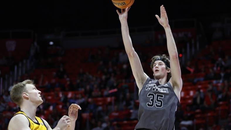 Feb 5, 2023; Salt Lake City, Utah, USA; Utah Utes center Branden Carlson (35) shoots over California Golden Bears forward Lars Thiemann (21) in the second half at Jon M. Huntsman Center. Mandatory Credit: Jeffrey Swinger-USA TODAY Sports
