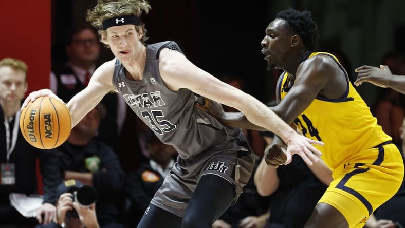 Feb 5, 2023; Salt Lake City, Utah, USA; Utah Utes center Branden Carlson (35) looks to drive against California Golden Bears forward Sam Alajiki (24) in the first half at Jon M. Huntsman Center. Mandatory Credit: Jeffrey Swinger-USA TODAY Sports
