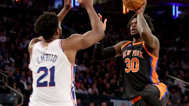 Feb 5, 2023; New York, New York, USA; New York Knicks forward Julius Randle (30) takes a shot against Philadelphia 76ers center Joel Embiid (21) during the fourth quarter at Madison Square Garden. Mandatory Credit: Brad Penner-USA TODAY Sports
