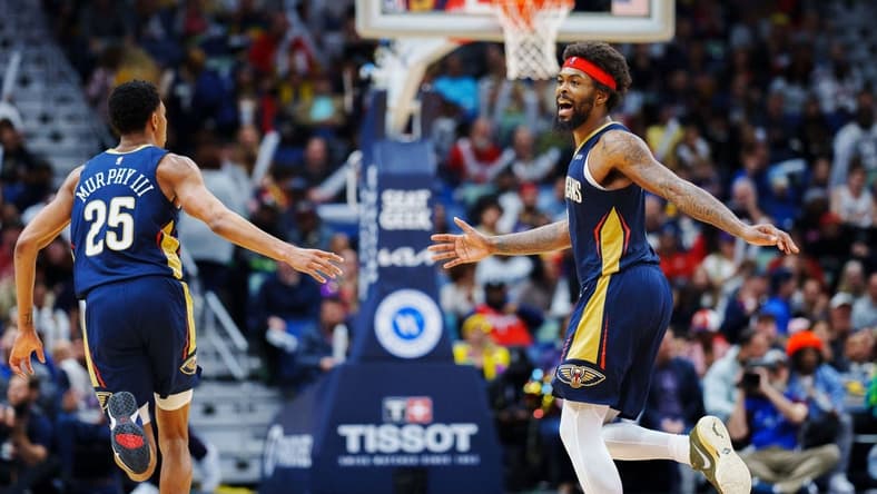 Feb 5, 2023; New Orleans, Louisiana, USA; New Orleans Pelicans forward Naji Marshall (8) and guard Trey Murphy III (25) react to a play against the Sacramento Kings during the third quarter at Smoothie King Center. Mandatory Credit: Andrew Wevers-USA TODAY Sports