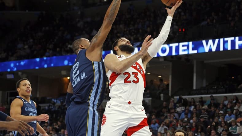 Feb 5, 2023; Memphis, Tennessee, USA; Toronto Raptors guard Fred VanVleet (23) shoots as Memphis Grizzlies forward Xavier Tillman (2) defends during the first half at FedExForum. Mandatory Credit: Petre Thomas-USA TODAY Sports