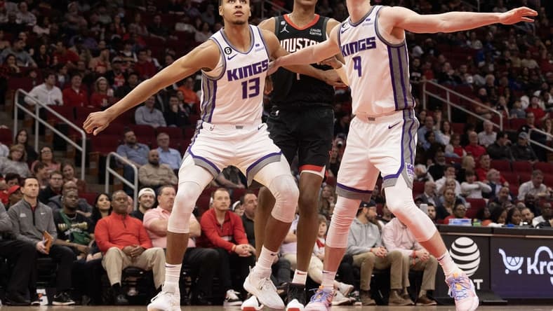 Feb 6, 2023; Houston, Texas, USA; Sacramento Kings forward Keegan Murray (13) and Sacramento Kings guard Kevin Huerter (9) block out Houston Rockets forward Jabari Smith Jr. (1) in the second quarter at Toyota Center. Mandatory Credit: Thomas Shea-USA TODAY Sports