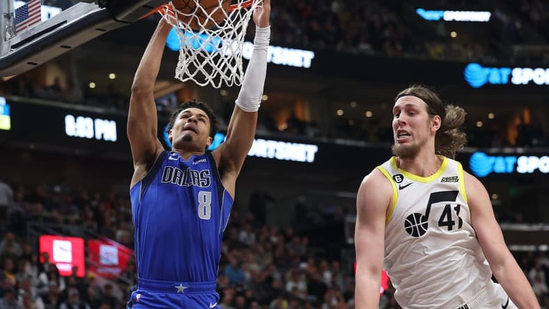 Feb 6, 2023; Salt Lake City, Utah, USA; Dallas Mavericks guard Josh Green (8) dunks the ball against Utah Jazz forward Kelly Olynyk (41) in the second quarter at Vivint Arena. Mandatory Credit: Rob Gray-USA TODAY Sports