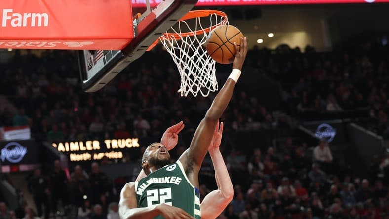 Feb 6, 2023; Portland, Oregon, USA; Milwaukee Bucks forward Khris Middleton (22) scores over Portland Trail Blazers in the first half at Moda Center. Mandatory Credit: Jaime Valdez-USA TODAY Sports