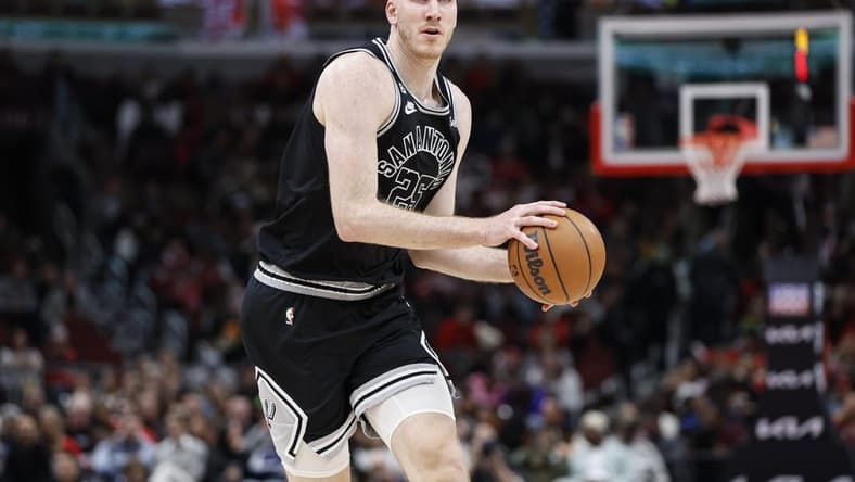 Feb 6, 2023; Chicago, Illinois, USA; San Antonio Spurs center Jakob Poeltl (25) brings the ball up court against the Chicago Bulls during the second half at United Center. Mandatory Credit: Kamil Krzaczynski-USA TODAY Sports
