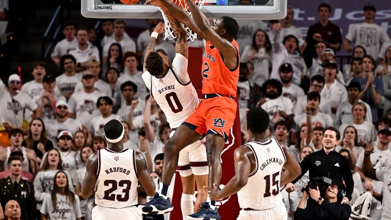 Feb 7, 2023; College Station, Texas, USA; Auburn Tigers guard Allen Flanigan (22) blocks Texas A&M Aggies guard Dexter Dennis (0) during the first half at Reed Arena. Mandatory Credit: Maria Lysaker-USA TODAY Sports