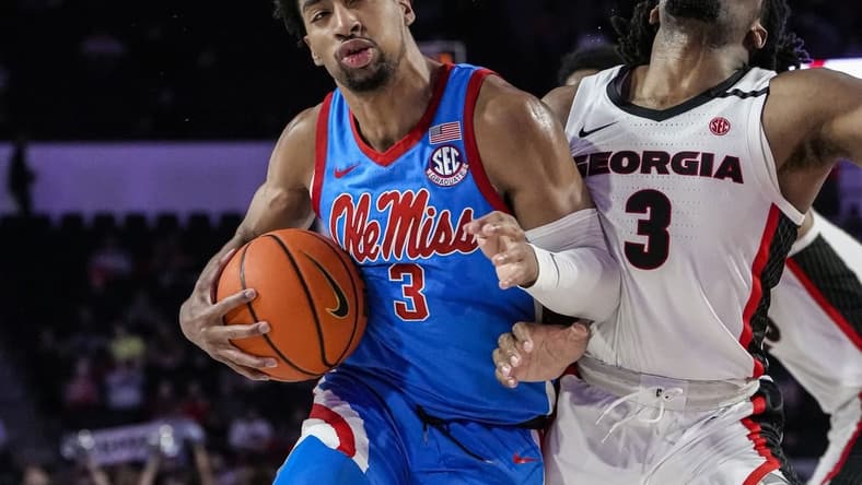 Feb 7, 2023; Athens, Georgia, USA; Mississippi Rebels forward Myles Burns (3) is called for a charging foul against Georgia Bulldogs guard Kario Oquendo (3) during the first half at Stegeman Coliseum. Mandatory Credit: Dale Zanine-USA TODAY Sports