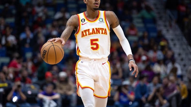 Feb 7, 2023; New Orleans, Louisiana, USA; Atlanta Hawks guard Dejounte Murray (5) brings the ball up court against the New Orleans Pelicans during the first half at Smoothie King Center. Mandatory Credit: Stephen Lew-USA TODAY Sports