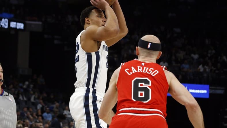 Feb 7, 2023; Memphis, Tennessee, USA; Memphis Grizzlies guard Desmond Bane (22) attempts a three-point shot during the first half against the Chicago Bulls at FedExForum. Mandatory Credit: Petre Thomas-USA TODAY Sports
