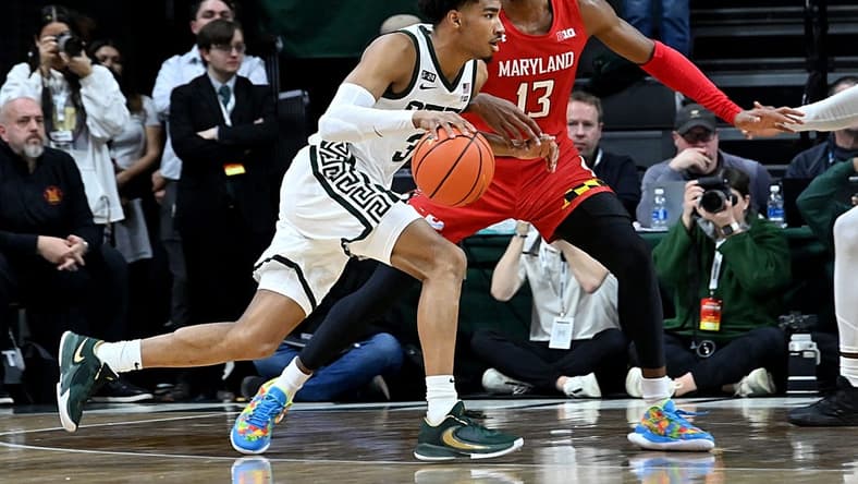 Feb 7, 2023; East Lansing, Michigan, USA; Michigan State Spartans guard Jaden Akins (3) drives past Maryland Terrapins guard Hakim Hart (13) in the first half at Jack Breslin Student Events Center. Mandatory Credit: Dale Young-USA TODAY Sports