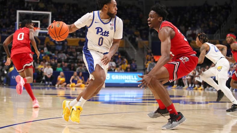 Pittsburgh Panthers Nelly Cummings (0) steals the ball from Louisville Cardinals Emmanuel Okorafor (34) during the second half on February 7, 2023 at the Petersen Events Center in Pittsburgh, PA.

Pittsburgh Panthers Vs Louisville Mens Basketball
