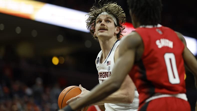 Feb 7, 2023; Charlottesville, Virginia, USA; Virginia Cavaliers forward Ben Vander Plas (5) prepares tp shoot the ball as North Carolina State Wolfpack guard Terquavion Smith (0) defends in the second half at John Paul Jones Arena. Mandatory Credit: Geoff Burke-USA TODAY Sports
