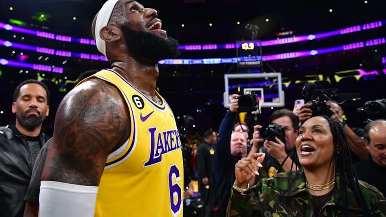 Los Angeles Lakers forward LeBron James (6) celebrates with his mother Gloria James after breaking the all-time scoring record in the third quarter against the Oklahoma City Thunder at Crypto.com Arena. Mandatory Credit: Gary A. Vasquez-USA TODAY Sports