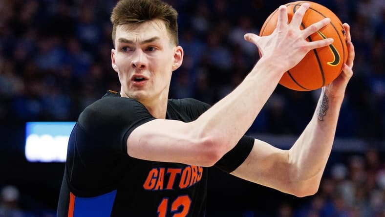 Feb 4, 2023; Lexington, Kentucky, USA; Florida Gators forward Colin Castleton (12) drives to the basket during the first half against the Kentucky Wildcats at Rupp Arena at Central Bank Center. Mandatory Credit: Jordan Prather-USA TODAY Sports