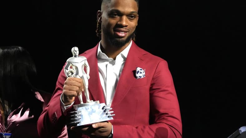 Feb 8, 2023; Phoenix, AZ, USA; Buffalo Bills safety Damar Hamlin accepts the Alan Page Community Award during the NFLPA press conference at the Phoenix Convention Center. Mandatory Credit: Kirby Lee-USA TODAY Sports