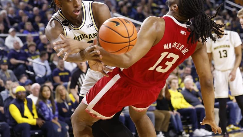 Feb 8, 2023; Ann Arbor, Michigan, USA; Nebraska Cornhuskers forward Derrick Walker (13) is fouled by Michigan Wolverines forward Tarris Reed Jr. (32) in the first half at Crisler Center. Mandatory Credit: Rick Osentoski-USA TODAY Sports