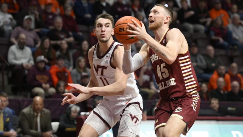Feb 8, 2023; Blacksburg, Virginia, USA; Boston Colle Eagles guard Mason Madsen (45) drives to basket in front of Virginia Tech Hokies forward John Camden (11) in the first half at Cassell Coliseum. Mandatory Credit: Lee Luther Jr.-USA TODAY Sports