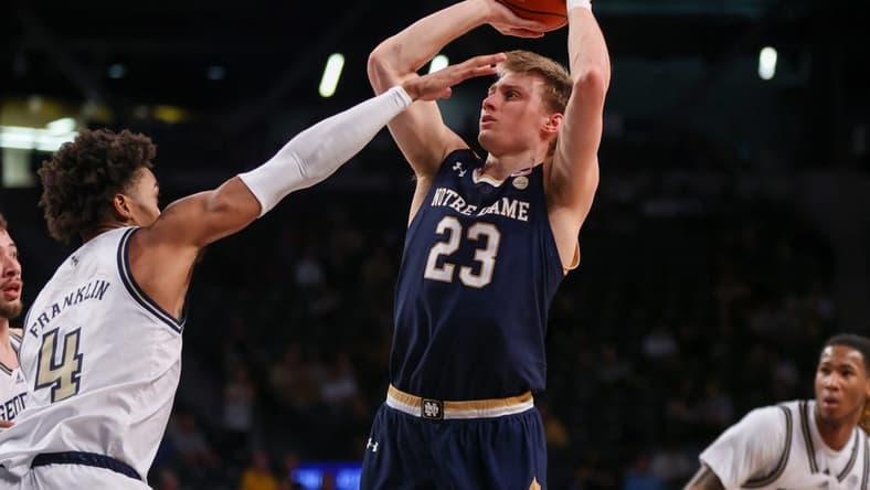 Feb 8, 2023; Atlanta, Georgia, USA; Notre Dame Fighting Irish guard Dane Goodwin (23) shoots past Georgia Tech Yellow Jackets forward Javon Franklin (4) in the first half at McCamish Pavilion. Mandatory Credit: Brett Davis-USA TODAY Sports