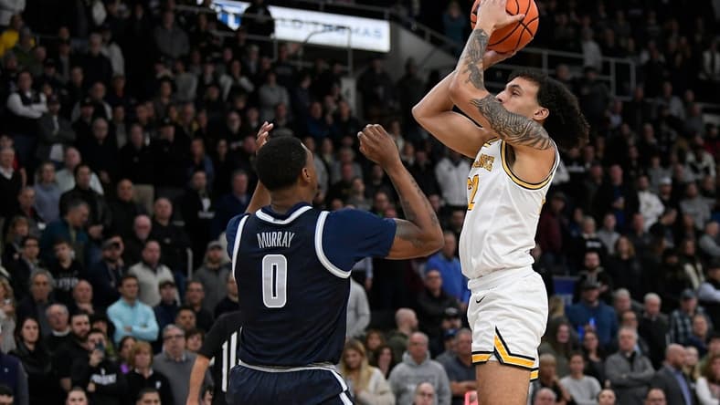 Feb 8, 2023; Providence, Rhode Island, USA; Providence Friars guard Devin Carter (22) shoots in front of Georgetown Hoyas guard Brandon Murray (0) during the first half at Amica Mutual Pavilion. Mandatory Credit: Eric Canha-USA TODAY Sports