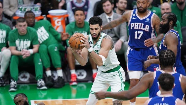 Feb 8, 2023; Boston, Massachusetts, USA; Boston Celtics guard Jaylen Brown (7) is hit by forward Jayson Tatum (0) against the Philadelphia 76ers in the second quarter at TD Garden. Mandatory Credit: David Butler II-USA TODAY Sports
