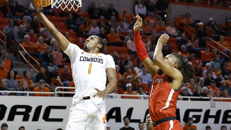 Feb 8, 2023; Stillwater, Oklahoma, USA; Oklahoma State Cowboys guard Bryce Thompson (1) goes to the basket in front of Texas Tech Red Raiders guard Lamar Washington (1) during the first half at Gallagher-Iba Arena. Mandatory Credit: Alonzo Adams-USA TODAY Sports