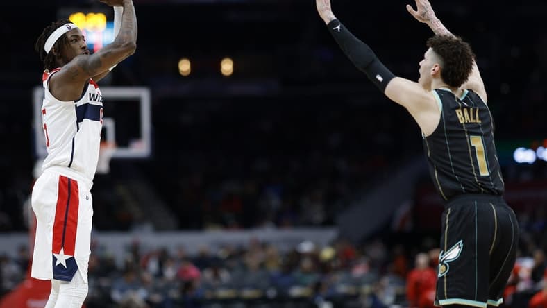 Feb 8, 2023; Washington, District of Columbia, USA; Washington Wizards guard Delon Wright (55) shoots the ball over Charlotte Hornets guard LaMelo Ball (1) in the third quarter at Capital One Arena. Mandatory Credit: Geoff Burke-USA TODAY Sports