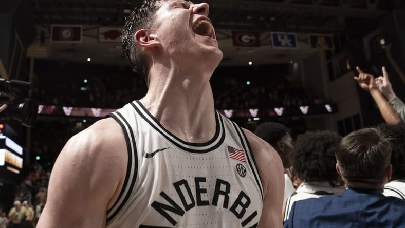 Feb 8, 2023; Nashville, Tennessee, USA; Vanderbilt Commodores forward Liam Robbins (21) celebrates after defeating the Tennessee Volunteers 66 to 65 at Memorial Gymnasium. Mandatory Credit: George Walker IV - USA TODAY Sports