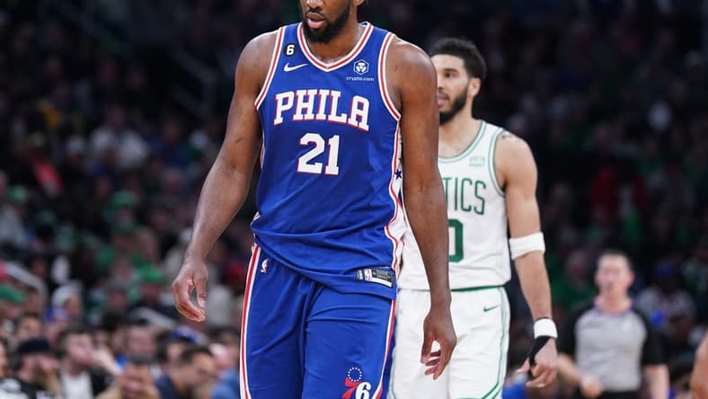 Feb 8, 2023; Boston, Massachusetts, USA; Philadelphia 76ers center Joel Embiid (21) and Boston Celtics forward Jayson Tatum (0) return up court in the second half at TD Garden. Mandatory Credit: David Butler II-USA TODAY Sports