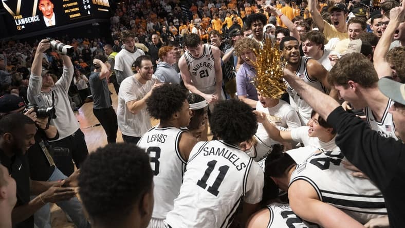 Feb 8, 2023; Nashville, Tennessee, USA; Vanderbilt Commodores players and students celebrate after defeating the Tennessee Volunteers 66 to 65 at Memorial Gymnasium. Mandatory Credit: George Walker IV - USA TODAY Sports