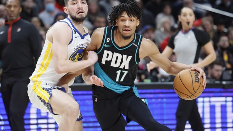 Feb 8, 2023; Portland, Oregon, USA; Portland Trail Blazers shooting guard Shaedon Sharpe (17) drives to the basket against Golden State Warriors shooting guard Ty Jerome (10) during the first half at Moda Center. Mandatory Credit: Soobum Im-USA TODAY Sports