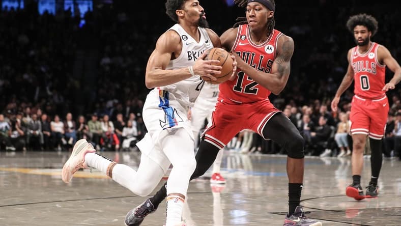 Feb 9, 2023; Brooklyn, New York, USA; Brooklyn Nets guard Spencer Dinwiddie (26) looks to drive past Chicago Bulls guard Ayo Dosunmu (12) in the second quarter at Barclays Center. Mandatory Credit: Wendell Cruz-USA TODAY Sports
