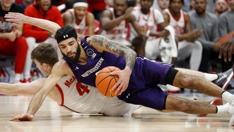 Feb 9, 2023; Columbus, Ohio, USA; Northwestern Wildcats guard Boo Buie (0) dives for the loose ball with Ohio State Buckeyes guard Sean McNeil (4) during the first half at Value City Arena. Mandatory Credit: Joseph Maiorana-USA TODAY Sports