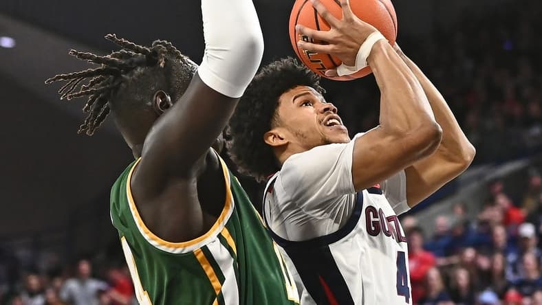 Feb 9, 2023; Spokane, Washington, USA; Gonzaga Bulldogs guard Rasir Bolton (45) shoots the ball against San Francisco Dons forward Ndewedo Newbury (21) in the second half at McCarthey Athletic Center. Mandatory Credit: James Snook-USA TODAY Sports