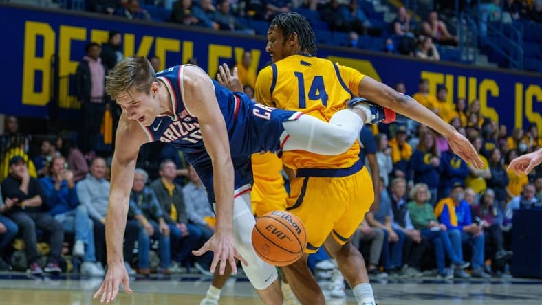 Feb 9, 2023; Berkeley, California, USA; Arizona Wildcats forward Azuolas Tubelis (10) is upended fouled by California Golden Bears forward Grant Newell (14) during the first half at Haas Pavilion. Mandatory Credit: Neville E. Guard-USA TODAY Sports