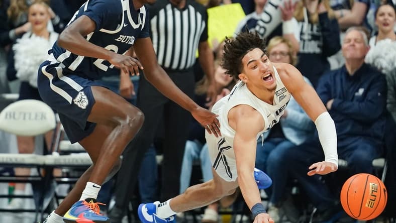 Feb 10, 2023; Indianapolis, Indiana, USA;  Xavier Musketeers guard Colby Jones (3) is fouled by Butler Bulldogs guard Ali Ali (24) during the first half at Hinkle Fieldhouse. Mandatory Credit: Robert Goddin-USA TODAY Sports