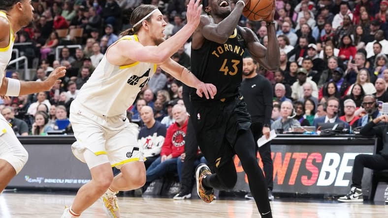 Feb 10, 2023; Toronto, Ontario, CAN; Toronto Raptors forward Pascal Siakam (43) drives to the basket as Utah Jazz forward Kelly Olynyk (41) tries to defend during the second quarter at Scotiabank Arena. Mandatory Credit: Nick Turchiaro-USA TODAY Sports