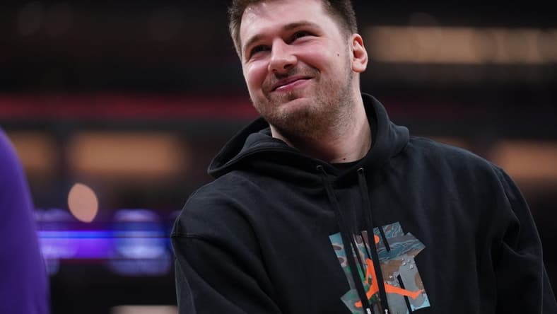 Feb 10, 2023; Sacramento, California, USA; Dallas Mavericks guard Luka Doncic (77) stands on the court during a timeout against the Sacramento Kings in the first quarter at the Golden 1 Center. Mandatory Credit: Cary Edmondson-USA TODAY Sports