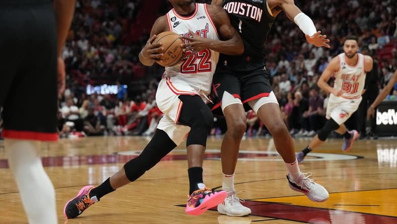 Feb 10, 2023; Miami, Florida, USA; Houston Rockets forward Jabari Smith Jr. (1) defends Miami Heat forward Jimmy Butler (22) in the first half at Miami-Dade Arena. Mandatory Credit: Jim Rassol-USA TODAY Sports